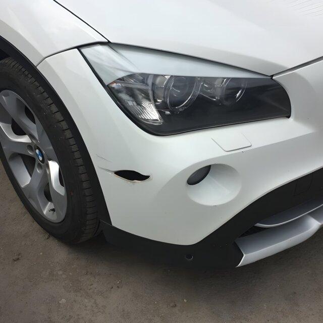 BMW X1: сварка пластика и покраска бампера — до
